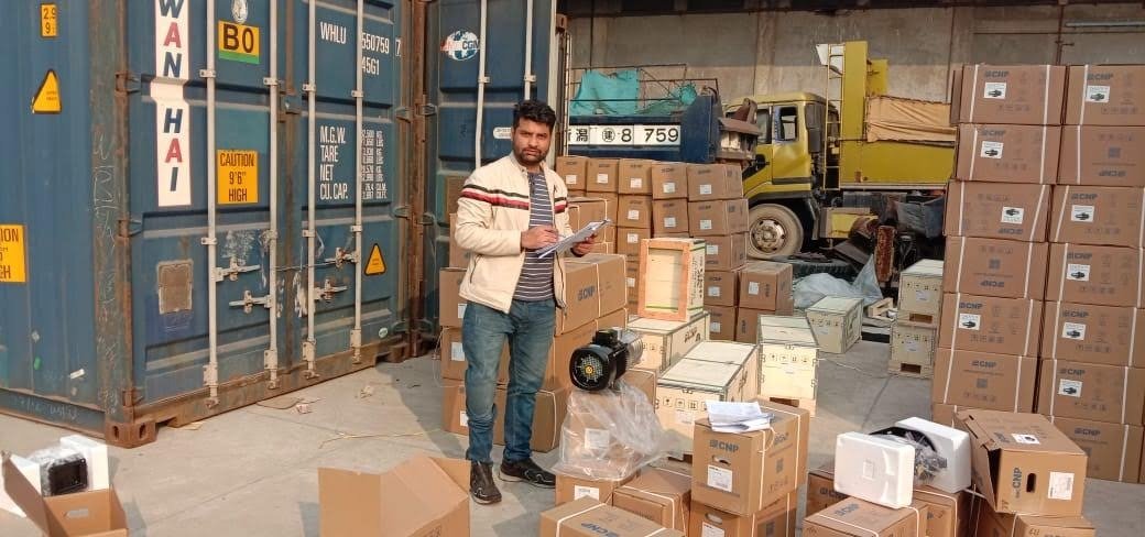 ZTC Logistics staff checking a consignment at a container yard